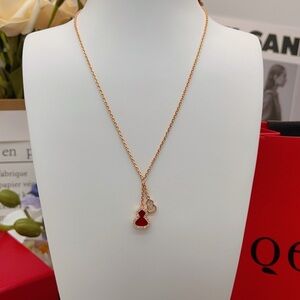 Elegant Gold Necklace with Red Heart Charm